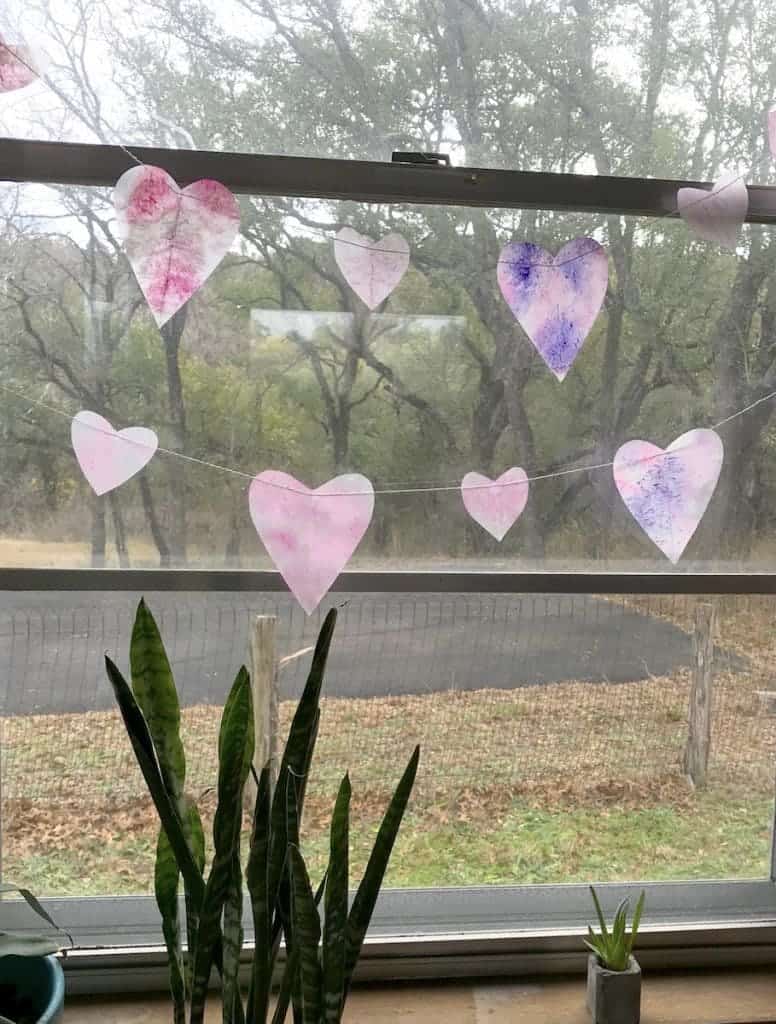 Make a pretty Valentine Heart Garland to hang in your window and catch the sunlight. | WildflowersandWanderlust.com