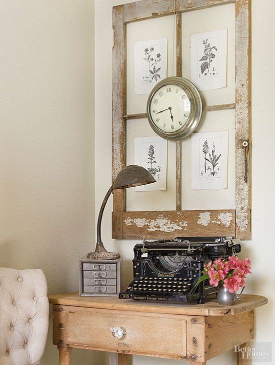 Using an old window as a frame is a great way to display art via bhg.com as featured on WildflowersAndWanderlust.com