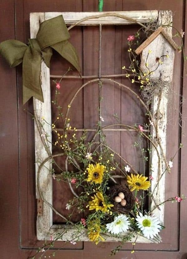 Using an old window and florals is a great way to decorate your front door for spring | WildflowersAndWanderlust.com