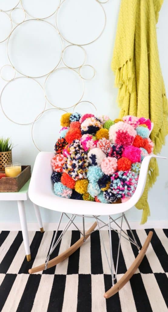 Make a pom pom pillow to sell at a craft fair WildflowersAndWanderlust.com