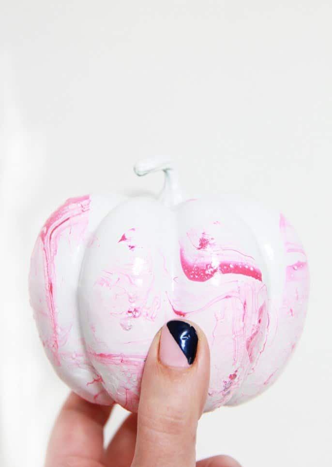 You can create marble pumpkins using nail polish