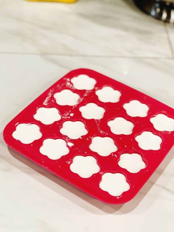 Once you've made up your baking soda ornament dough you can put it into a mold to make pretty shapes.