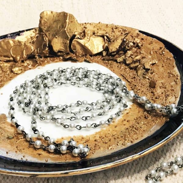 Metallic gold and black paint were used to make this crystal jewelry dish
