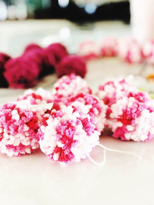 Pink pom poms ready for a wreath