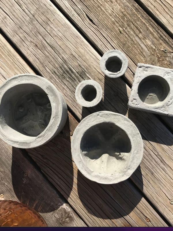 An assortment of DIY concrete pots | WildflowersAndWanderlust.com