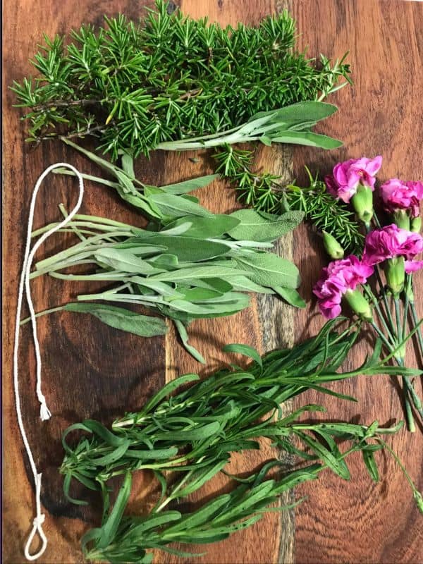 We used sage, lavender, rosemary and some carnations to make our smudge sticks for spring | WildflowersAndWanderlust.com