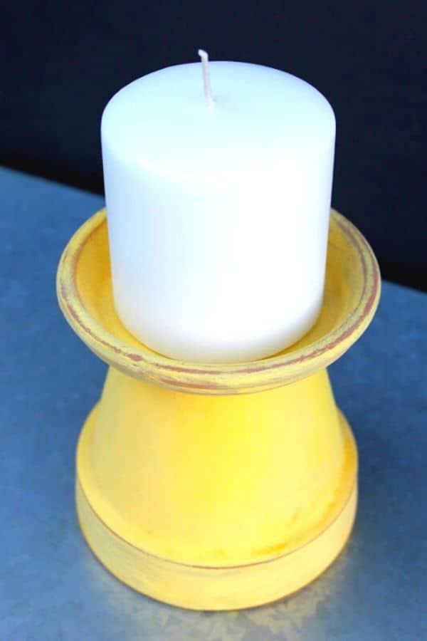 A terra cotta plant pot and saucer create a great candle holder by Ginger Snap Crafts